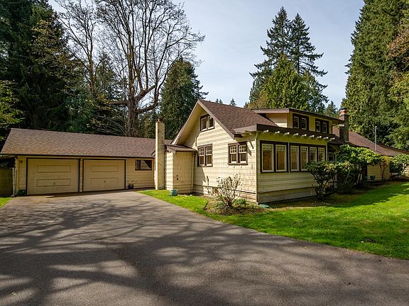 Detached two car garage (with electric garage door openers) and wood shed.