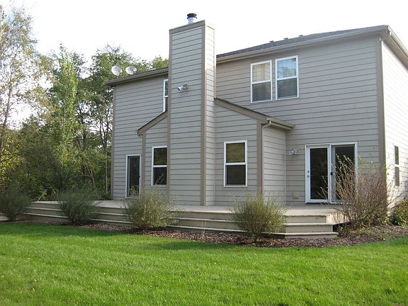 An Oversized Deck Leads To The Serene Backyard