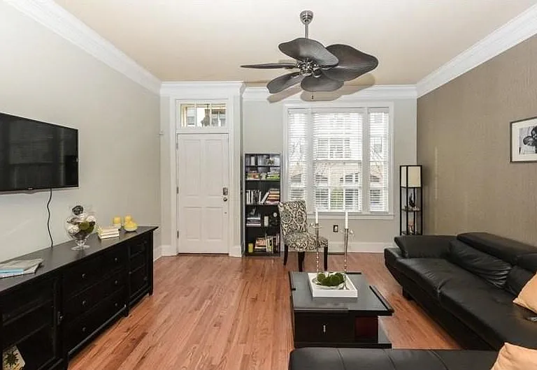 Spacious living room with fan