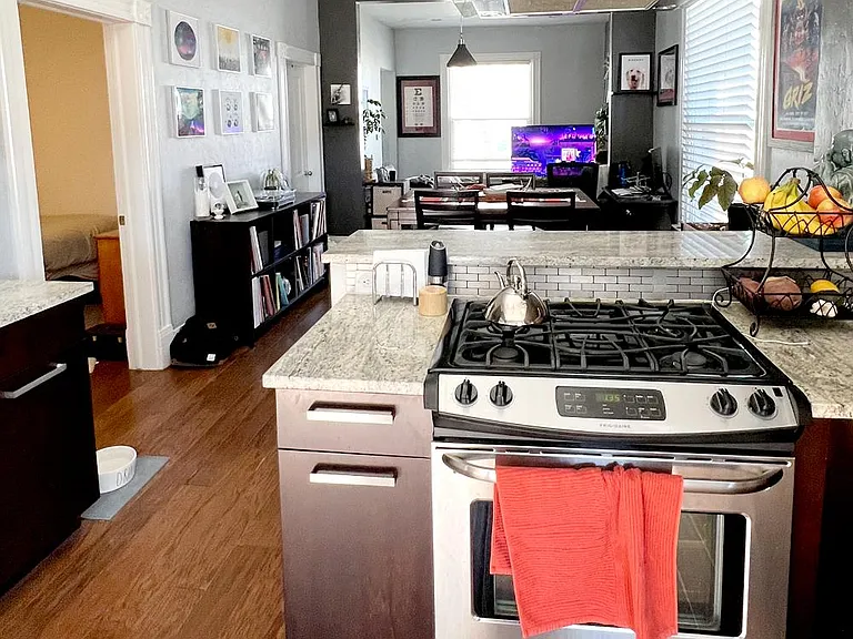 A view of the open layout with the two bedrooms on the left.