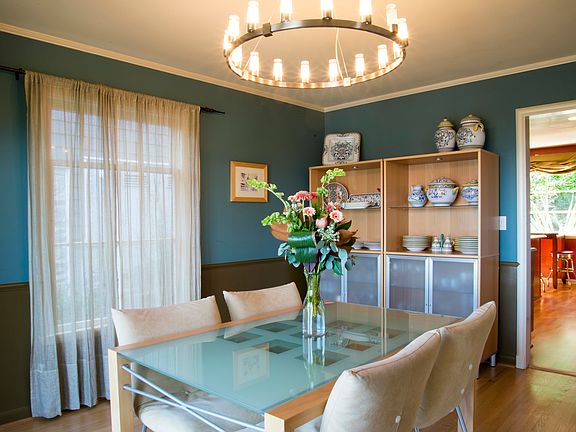 Spacious dining room with French doors with views of downtow