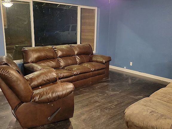 living room with ceiling fan
