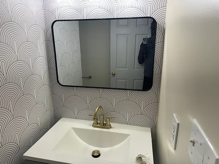 Newly renovated full bathroom. Vanity, mirror, new toilet and refinished tub.