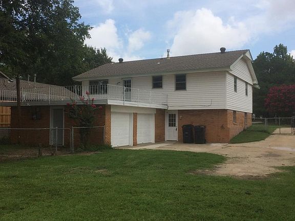 Back of house and fenced yard