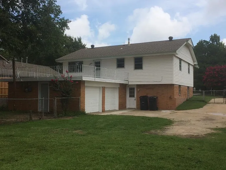 Back of house and fenced yard