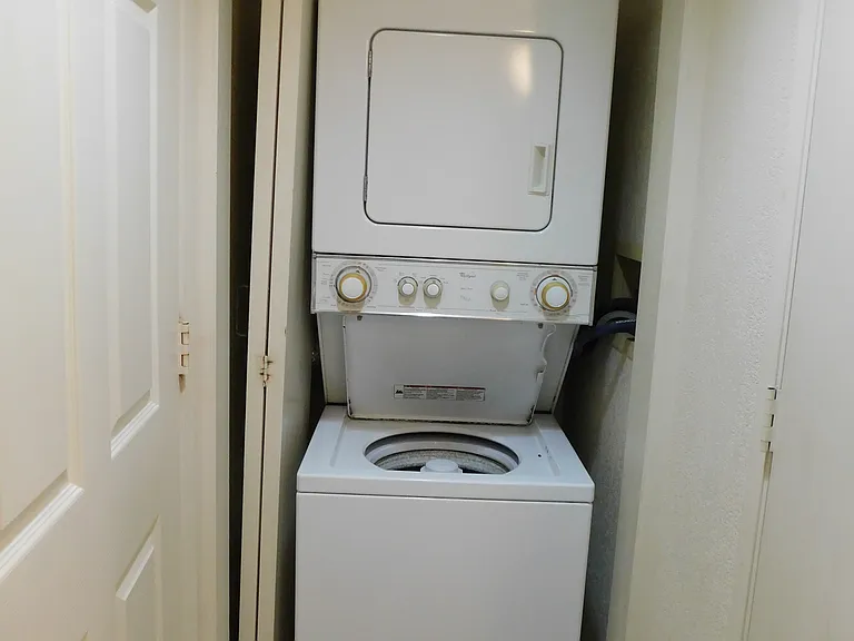 Stacked washer/dryer in the unit.