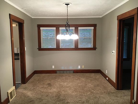 Dining room windows overlook private backyard