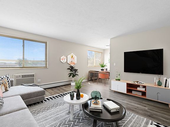 Sunlit living room with flexible space for work or play