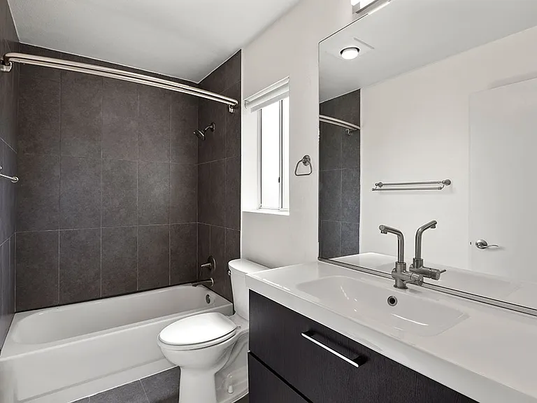 Modern styled bathroom with tub and shower.