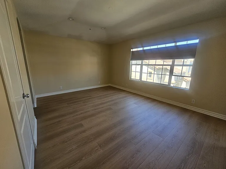 Masterbedroom with walk in closet and mirrored sliding closet