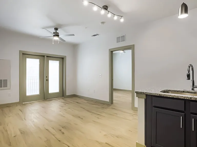 living room with bedroom in the background