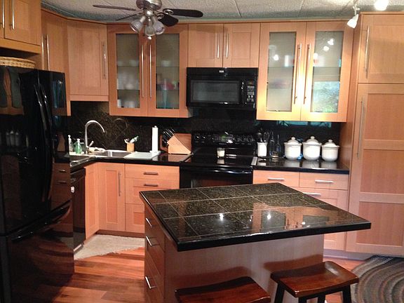 Open floor plan with granite kitchen and dining area