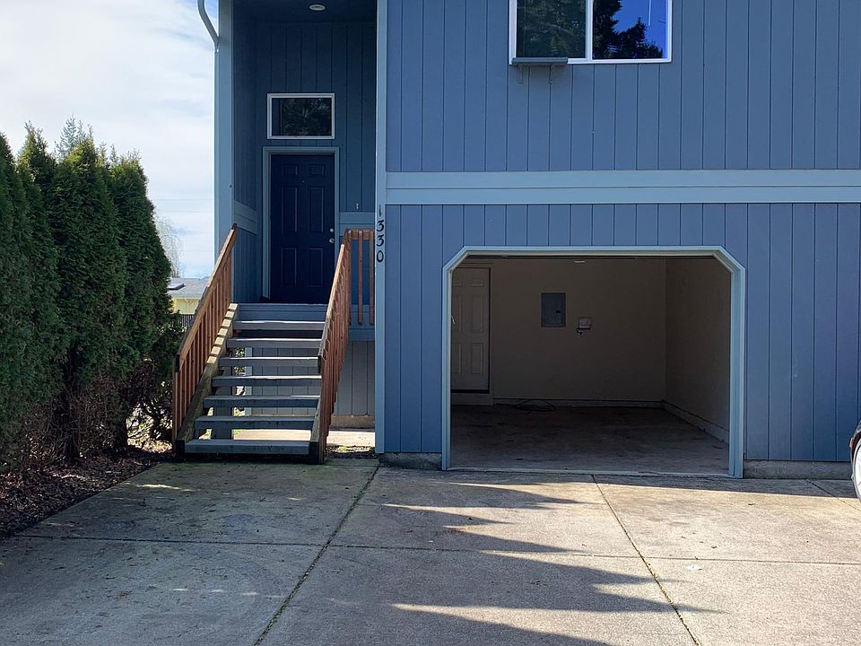 Front of townhouse/duplex. Front entrance, garage and master bedroom window.