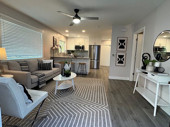 Living area flows into the kitchen and dining area, offering a modern open-concept design.