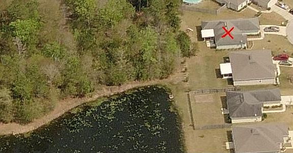 Ariel View Side - House has Red X