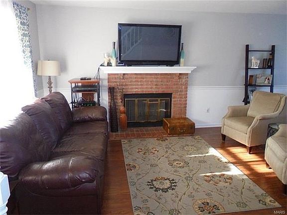 As you walk into this home you enter the comfortable living room offering a wood burning fireplace.