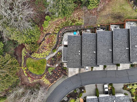 Most of the yard and landscaping to the left of the townhouse has been maintained by the seller but does not convey with the sale.>