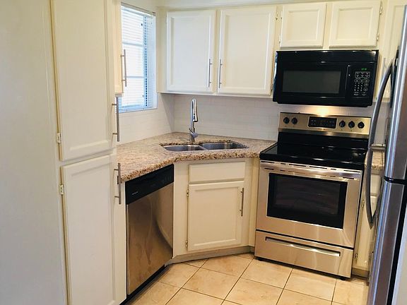 Updated kitchen with granite counters and stainless steel appliances