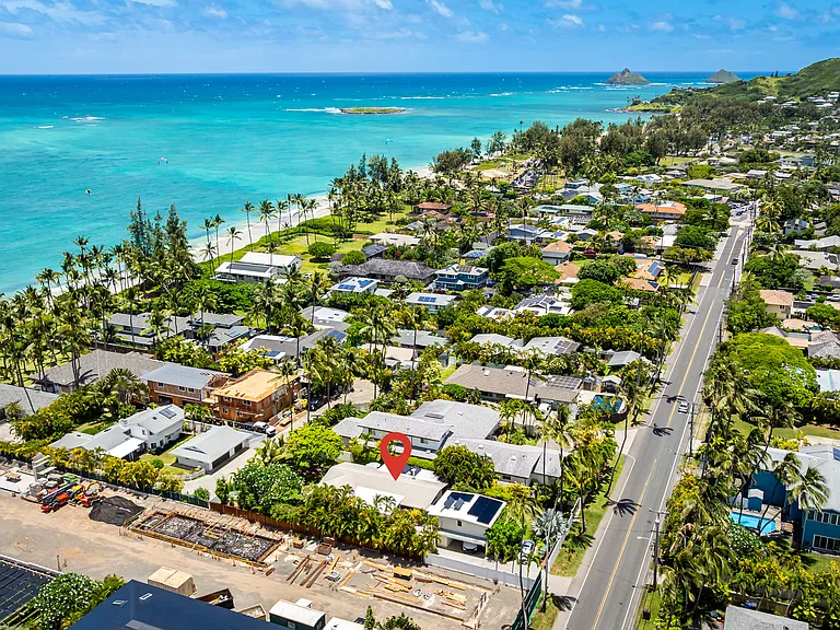 Aerial view of the property and surrounding Kailua Beach coastline with the Mokulua Islands in the distance.