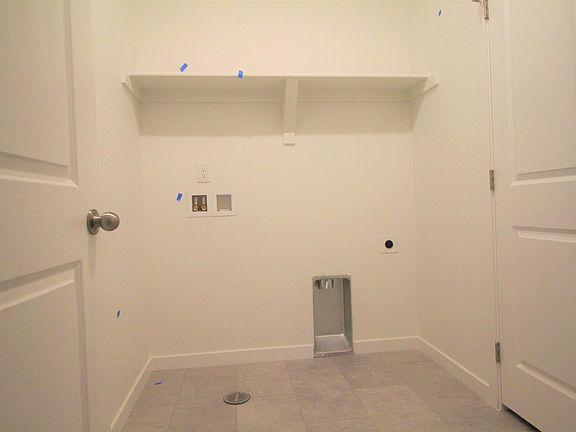 Large laundry room will soon have brand new washer and dryer.