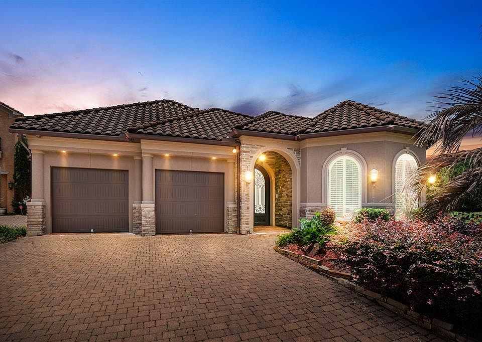 Welcome to 87 Lake Sterling Gate Drive, an incredible 1 story Mediterranean style patio home in the gated community of Lakes of Sterling Gate.