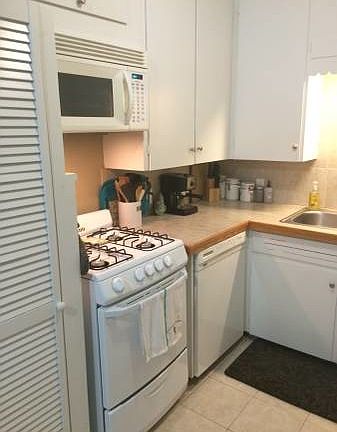 Kitchen with dishwasher, microwave, and disposal