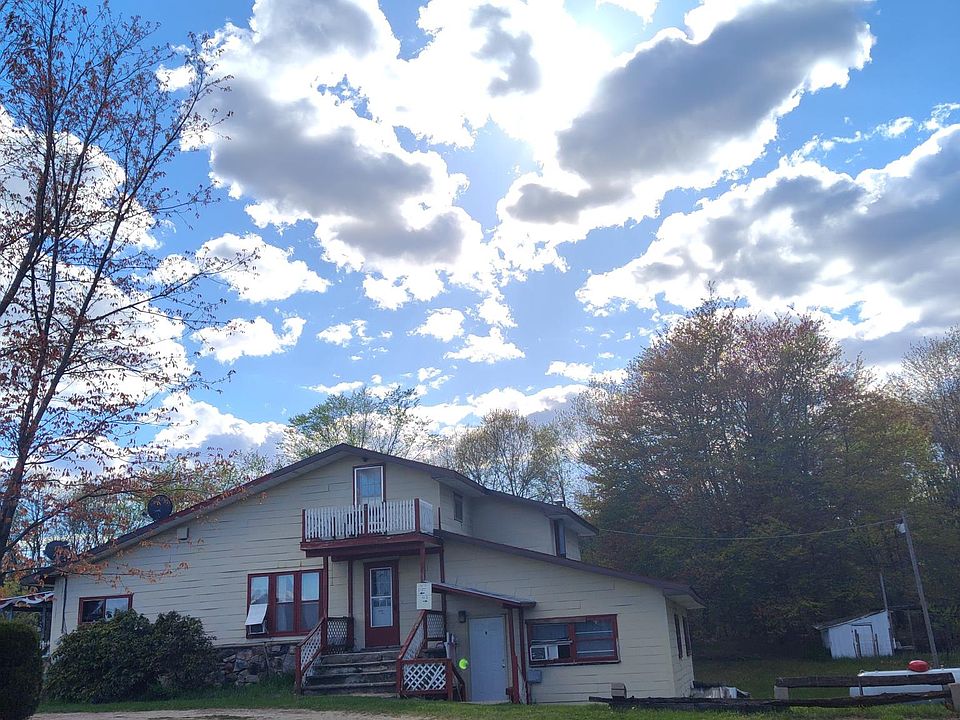 Front of house with parking on the right side.