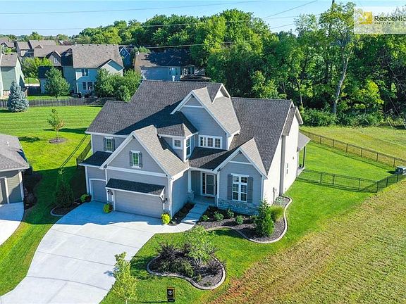 This home offers a unique front elevation and curb appeal plus! The front landscaping also boasts hardscaping around the beds - an additional feature that really makes the home stand out.