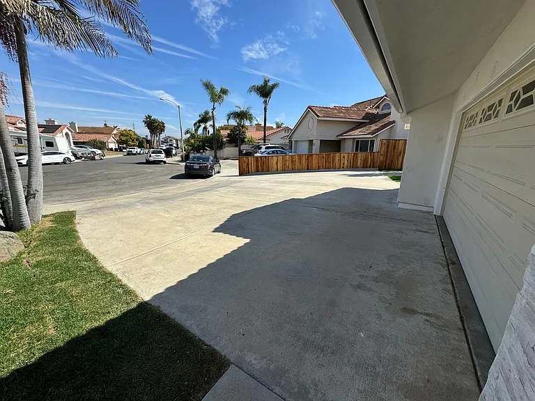Driveway holds 4 cars comfortably across and can park 2 deep if needed.