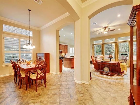 Immaculate interior with tall ceilings, plantation shutters, arched entries, crown molding and more.