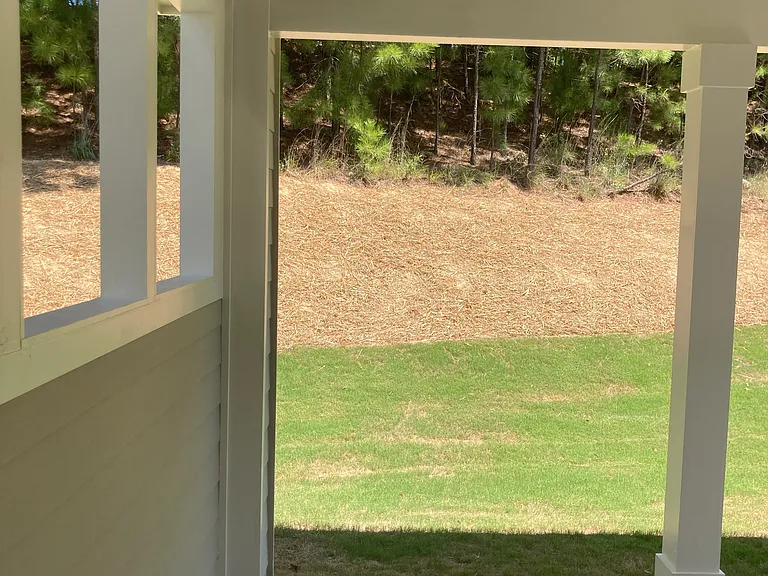Covered patio with privacy wall on one side