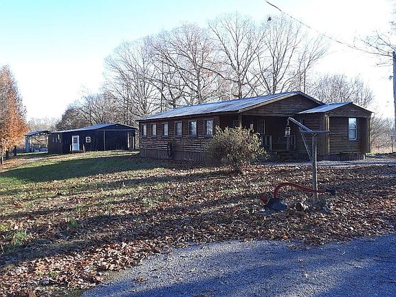 garage & shed in background