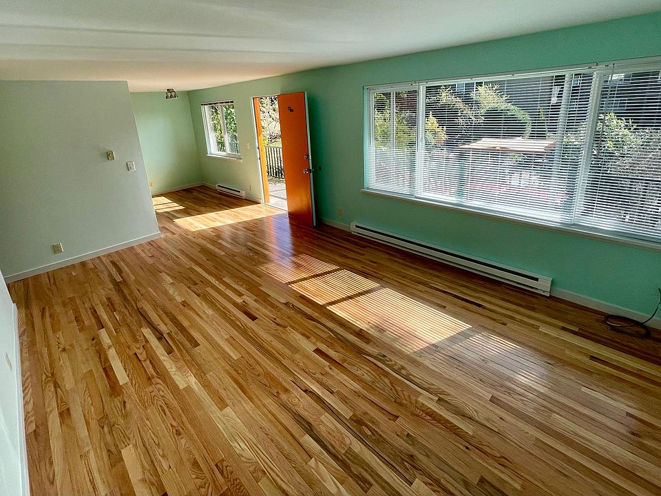 Apt 5. Living room with new hardwood floors, great light.