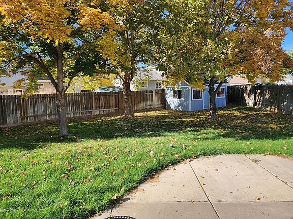 Large Mature Shade trees, fully fenced yard and extra large shed in the backyard