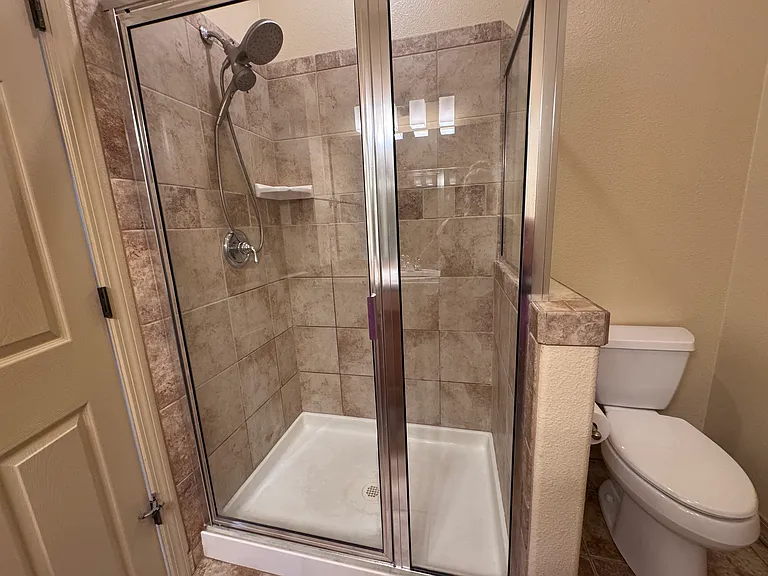 Primary Bathroom Shower & Toilet