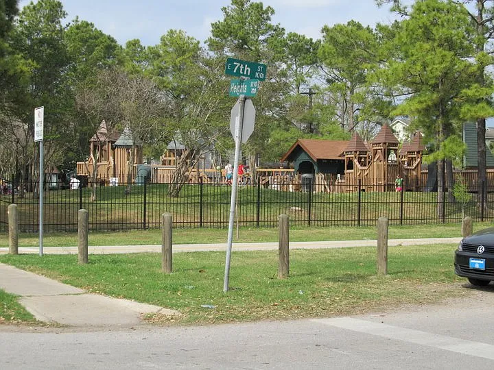 A PARK at the end of the block for families. The PARK is across from Restaurants and shops on Heights Blvd