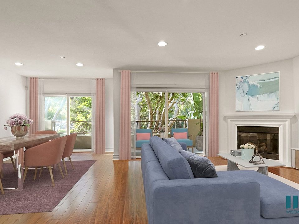 Spacious Dining and Living Room with Recessed Lighting, Vinyl Flooring, Electric Fireplace, and Balcony