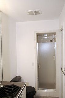 Downstairs bathroom with sink, toilet and shower