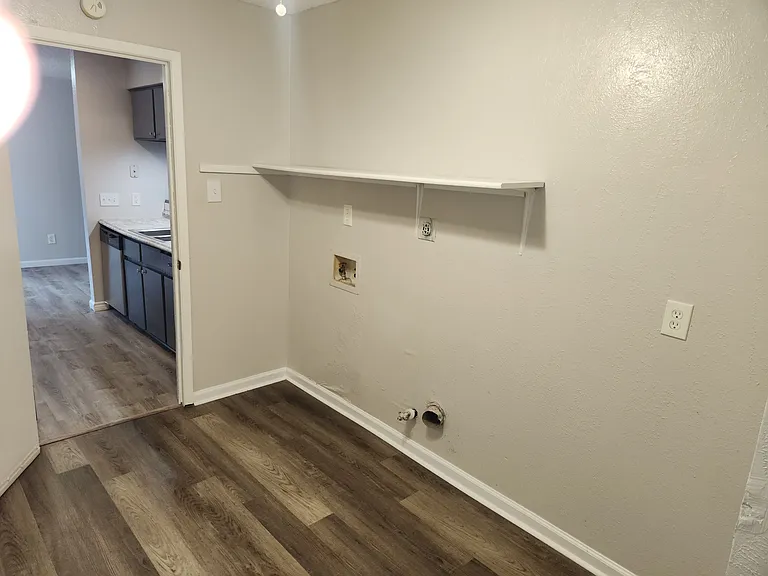 2 bedroom duplex laundry room, view to kitchen.