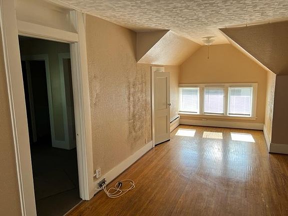 Living room view and entrance to bedroom.