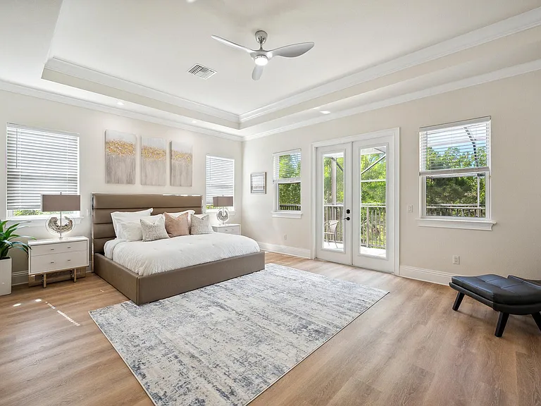 Primary bedroom suite with two walk-in closets and it's very open private balcony.