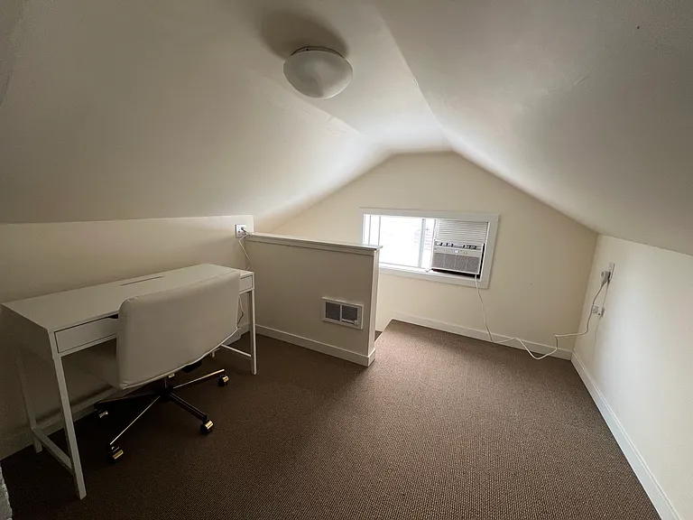 The working space is in the very short (5'5" at the tallest point) loft. There's a window a/c and a cadet heater.