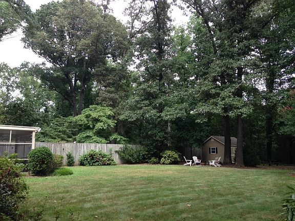 Private back yard with screen porch and shed