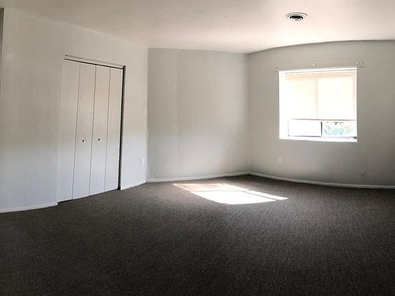 Large bedroom with window that overlooks the front of the building. Double wide closet...