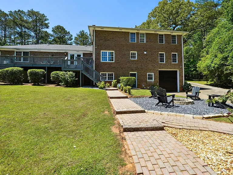 Back of the house with staircase to Upper Back Patio