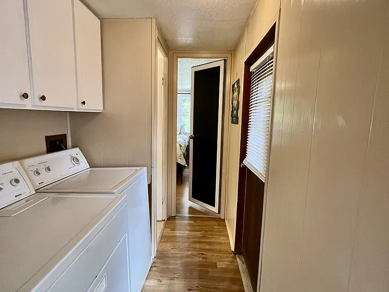 Washer/ Dryer Hook-ups in hallway.