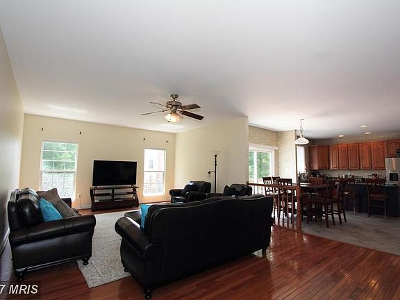 Family room with gleaming hardwood floors
