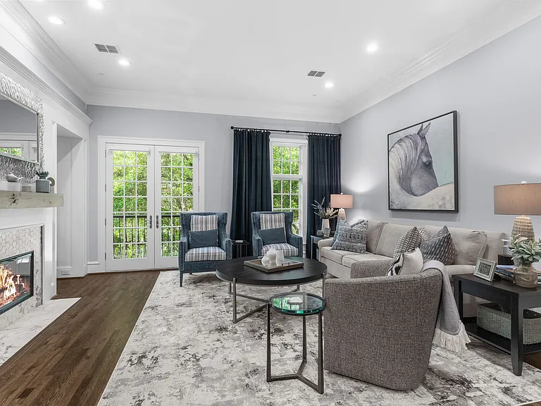 Elegant 2nd-floor living space featuring a cozy fireplace and seamless flow.