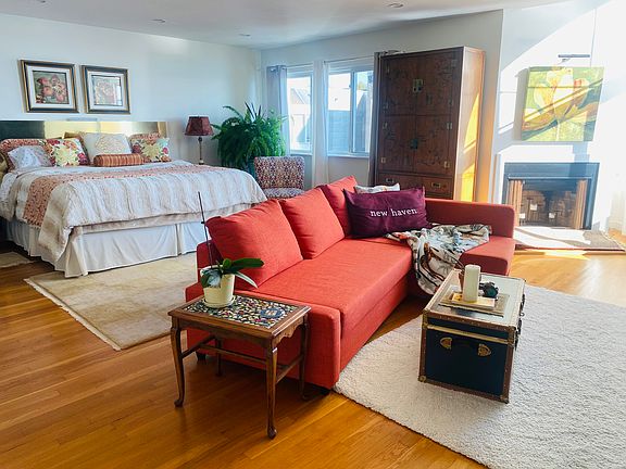 Large primary bedroom big enough for another living room with attached bathroom and walk in closet.