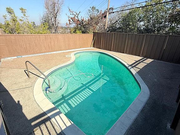 pool in fenced in backyard